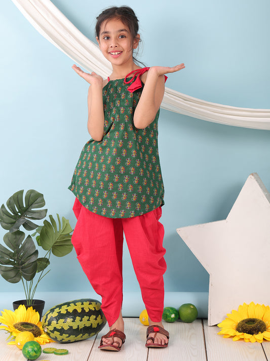 Green floral sleeveless tie on Kurti with Red Dhoti