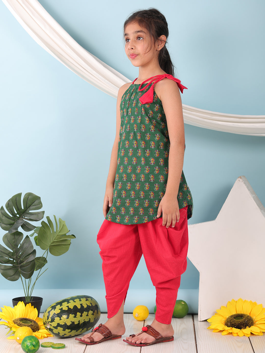 Green floral sleeveless tie on Kurti with Red Dhoti