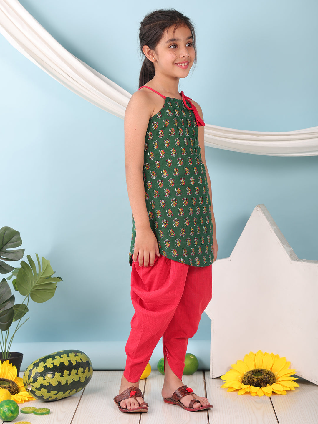 Green floral sleeveless tie on Kurti with Red Dhoti