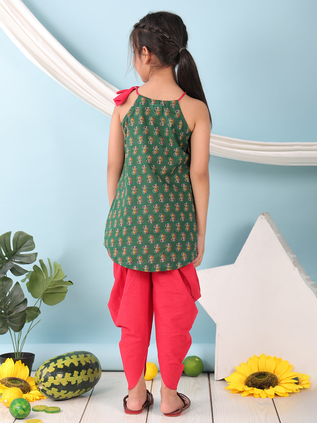 Green floral sleeveless tie on Kurti with Red Dhoti