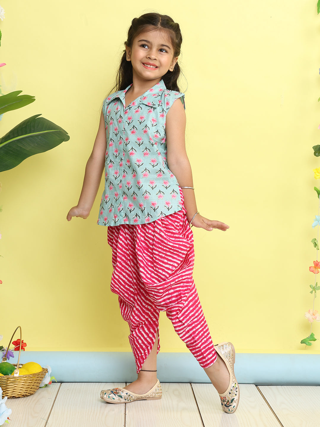 Green Floral Printed sleeveless Kurti paired with Pink lehriya Dhoti