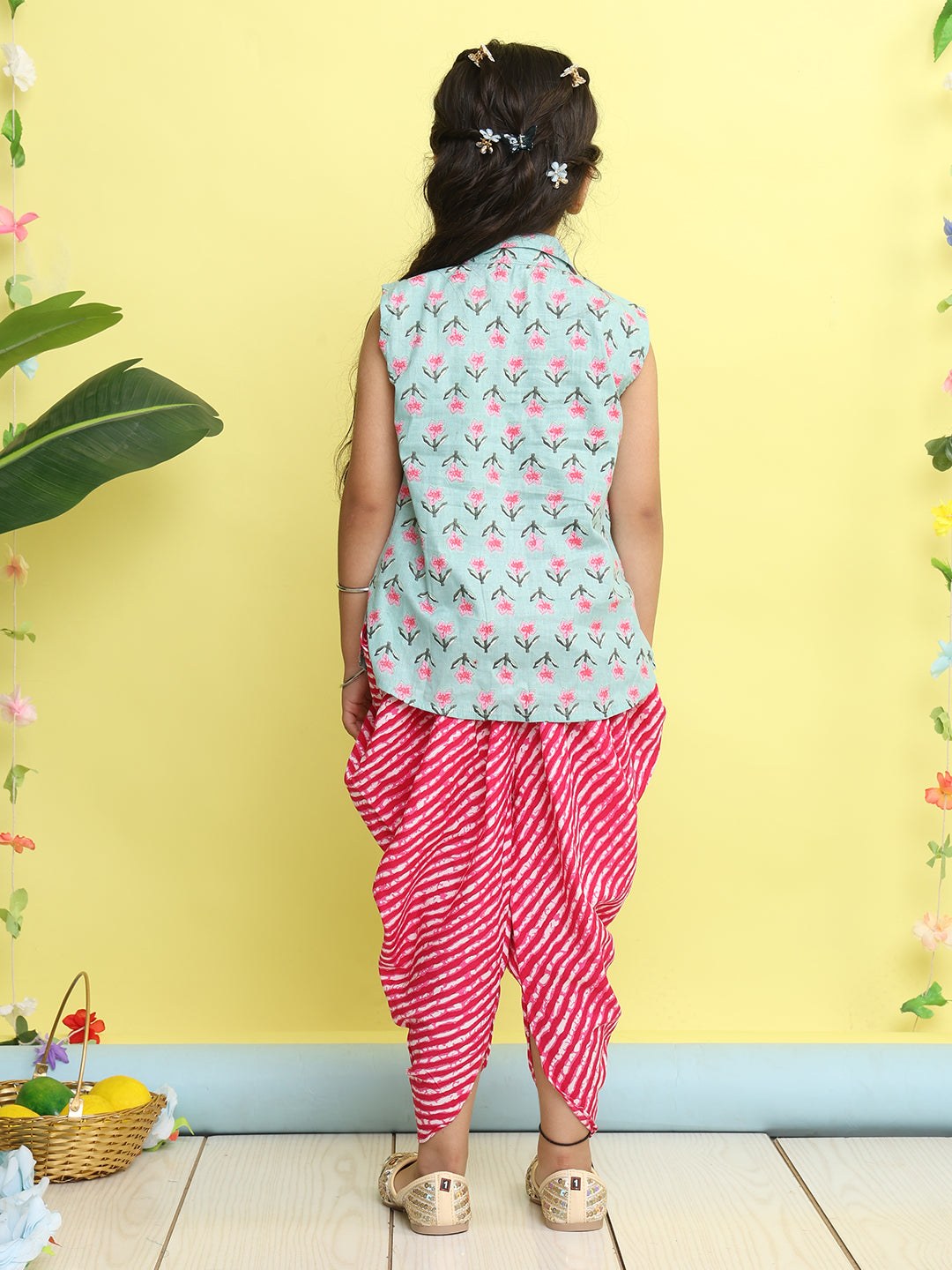 Green Floral Printed sleeveless Kurti paired with Pink lehriya Dhoti