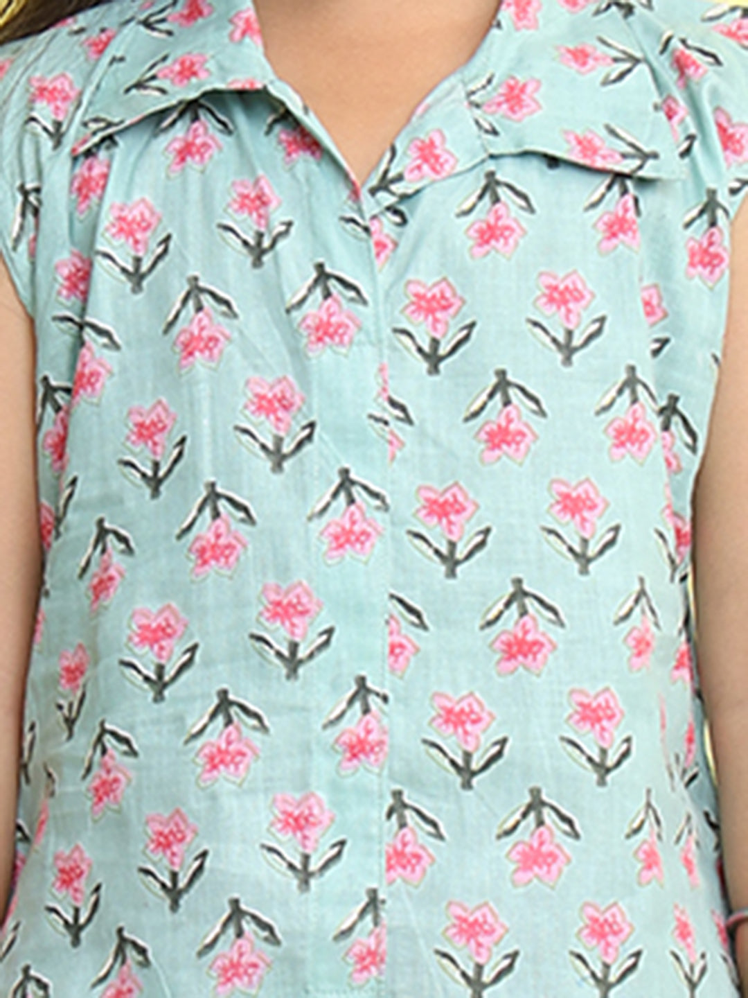 Green Floral Printed sleeveless Kurti paired with Pink lehriya Dhoti