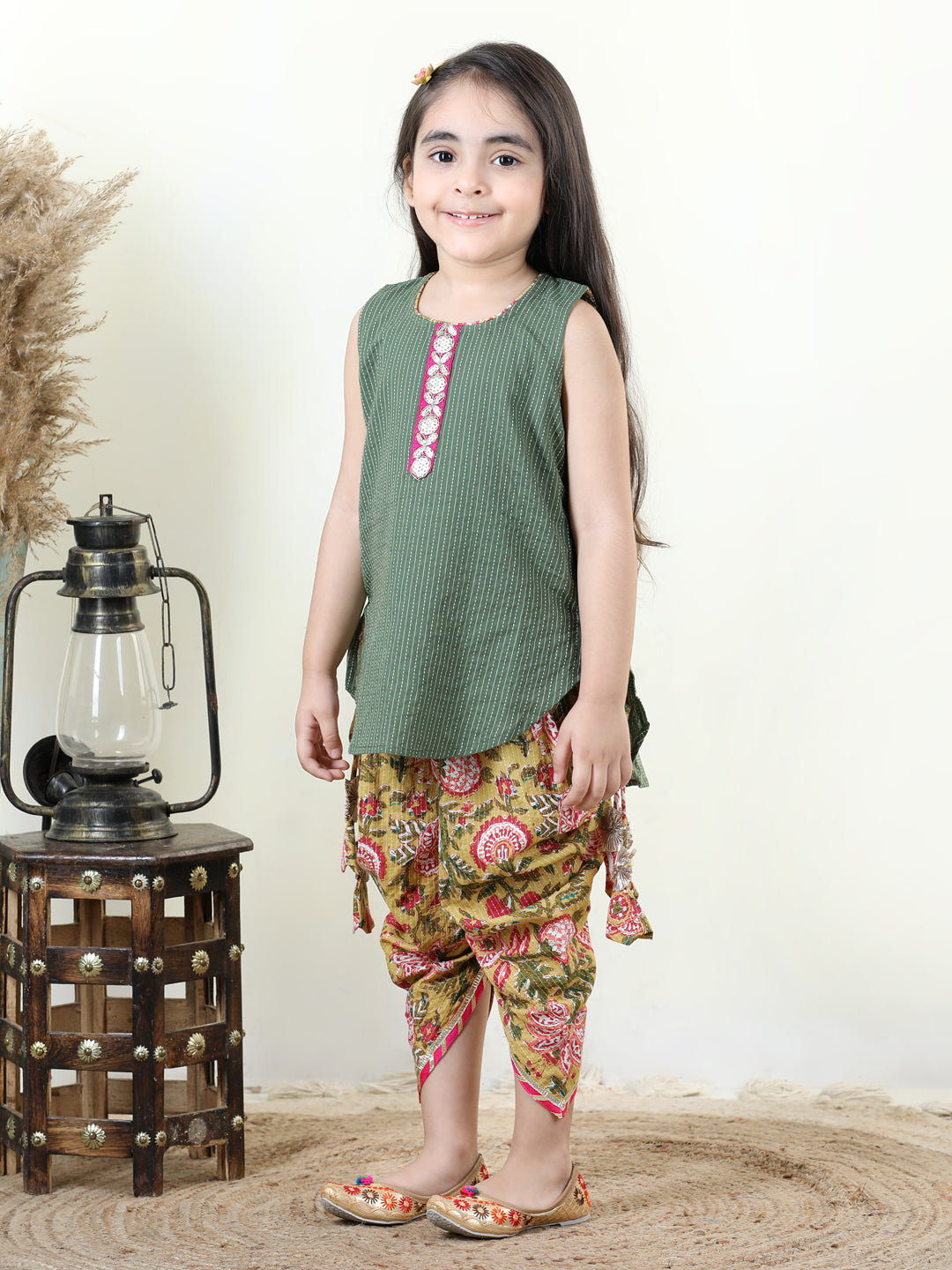 Yellow Floral printed dhoti paired with Green katha Kurti with a lace border at the neckline