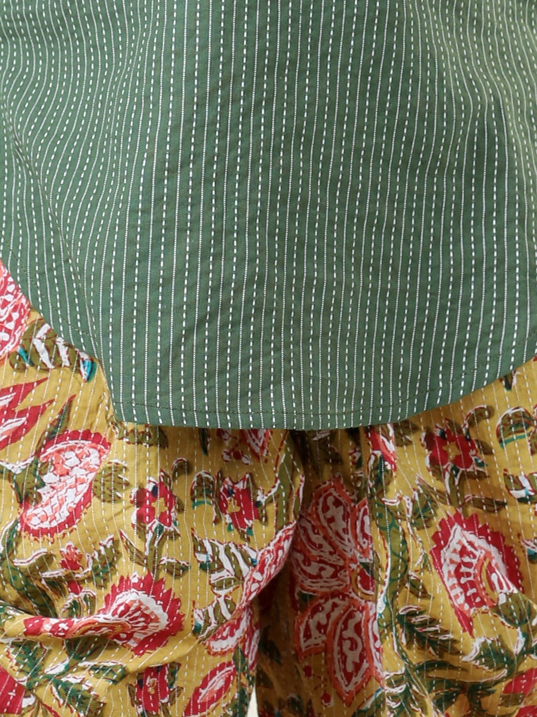 Yellow Floral printed dhoti paired with Green katha Kurti with a lace border at the neckline