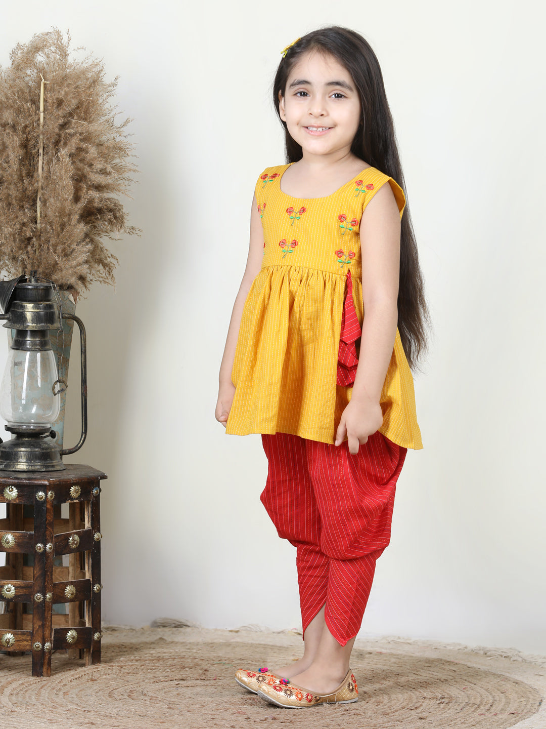 Yellow Embroidered kurti paired with dhoti