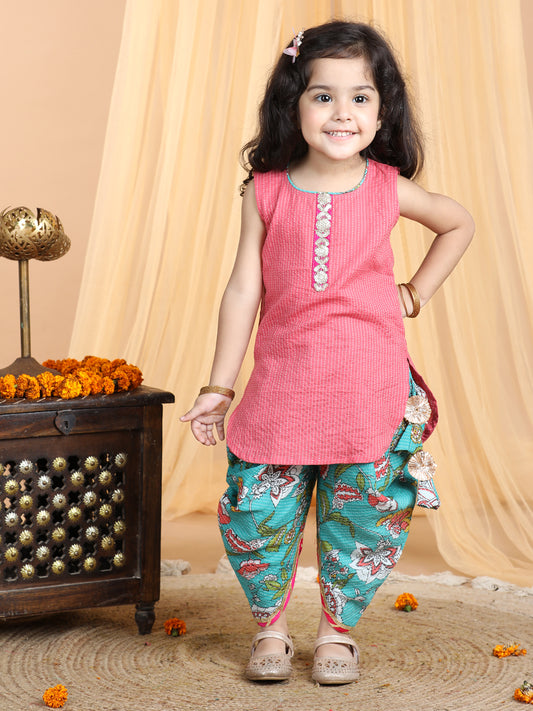 Floral printed dhoti paired with Peach katha Kurti with a lace border at the neckline