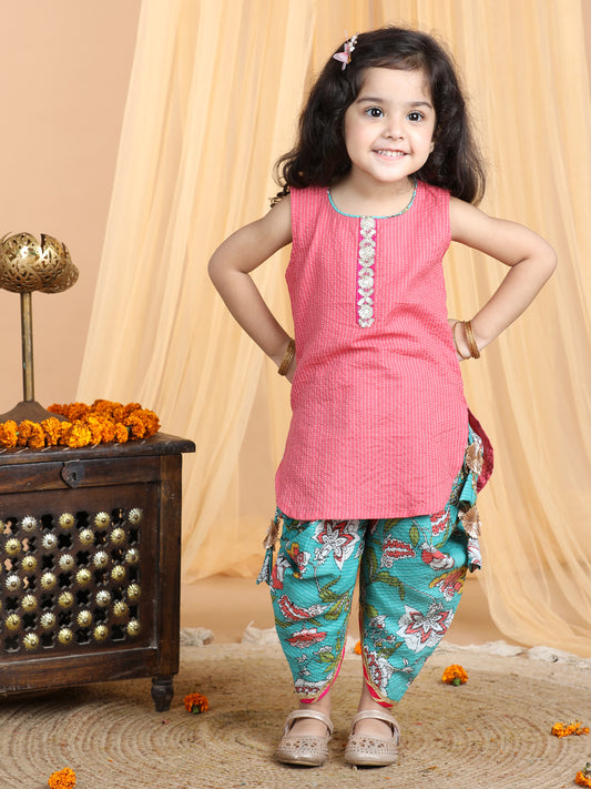 Floral printed dhoti paired with Peach katha Kurti with a lace border at the neckline