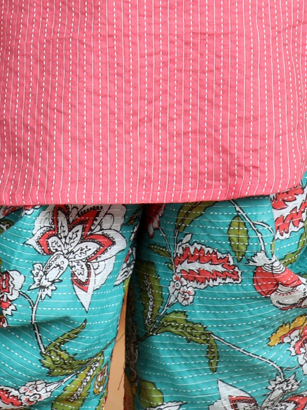 Floral printed dhoti paired with Peach katha Kurti with a lace border at the neckline