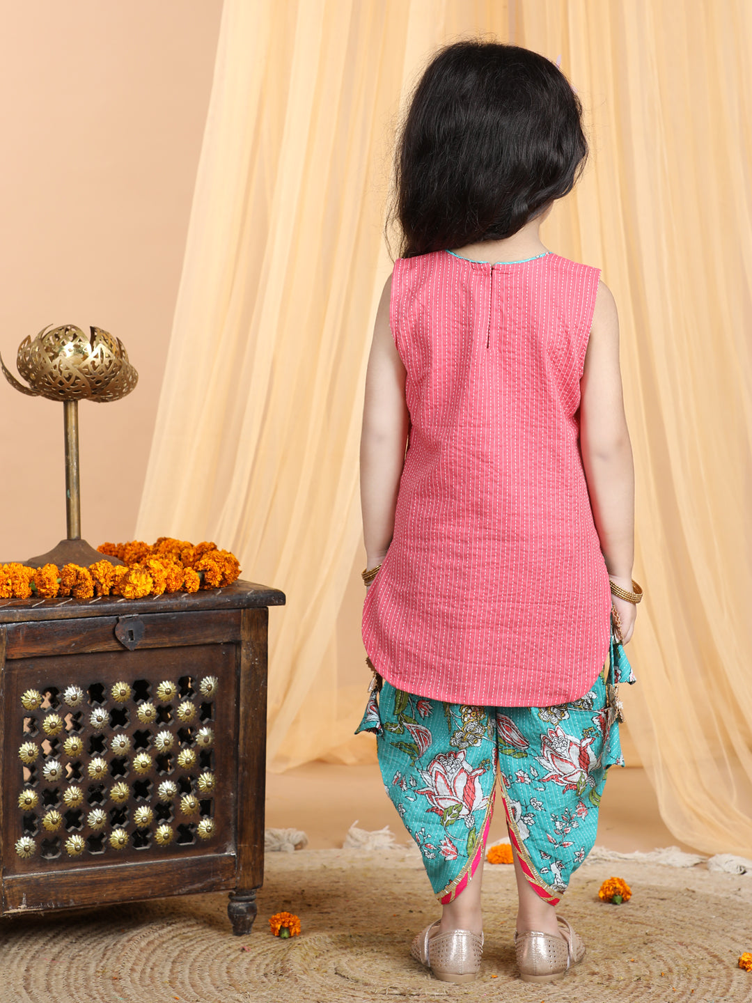 Floral printed dhoti paired with Peach katha Kurti with a lace border at the neckline
