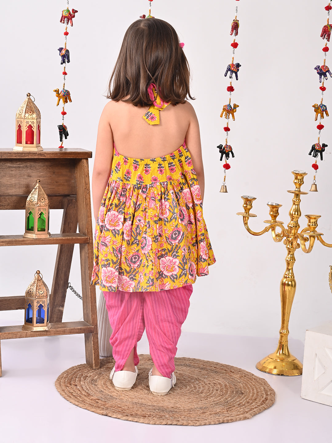 Yellow Floral halter style Kurti with pink dhoti