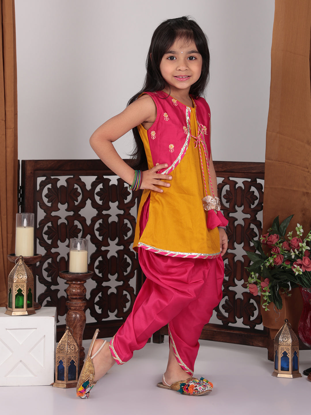 Yellow Kurti with pink embroidered attached jacket  and dhoti