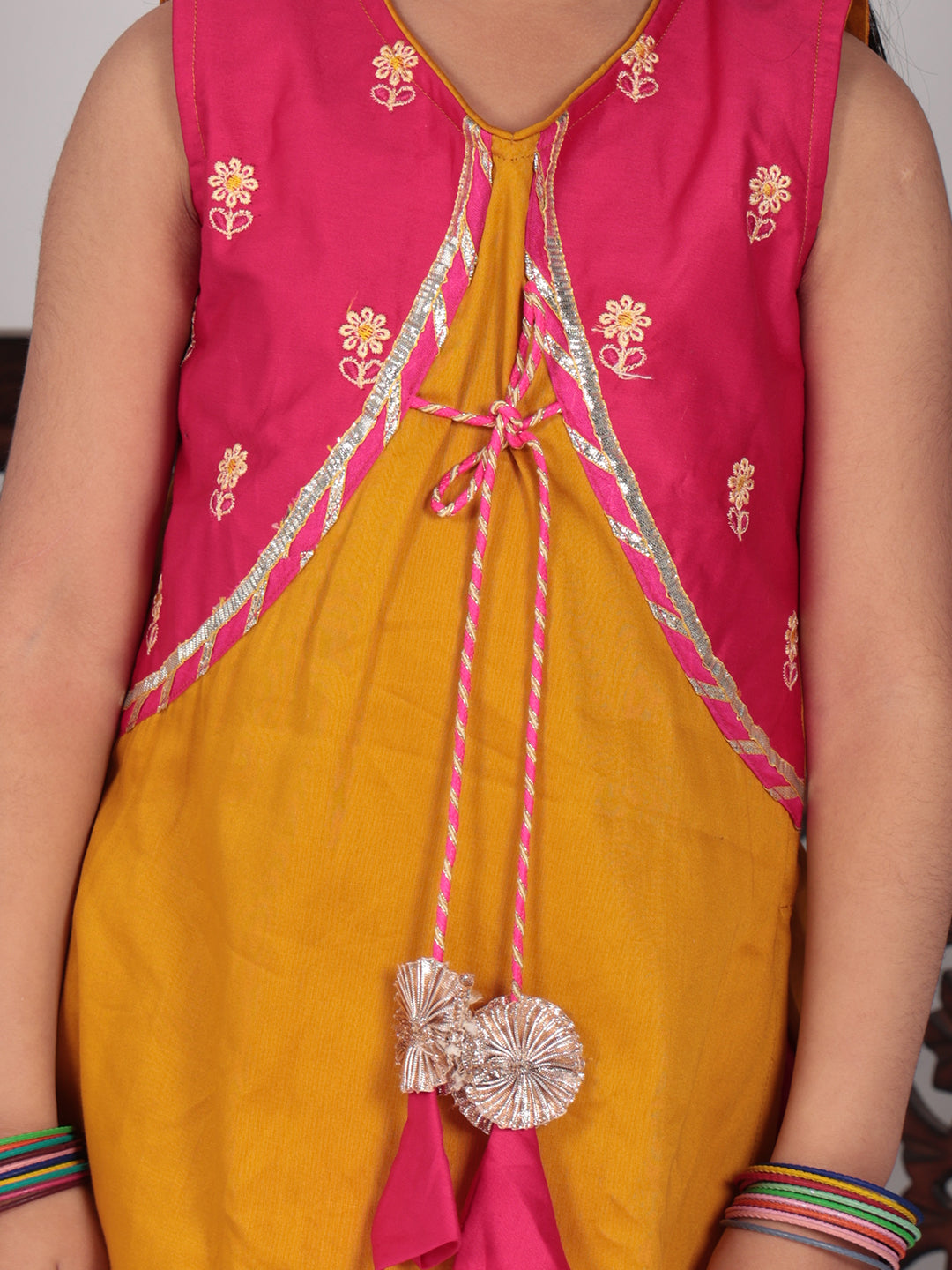 Yellow Kurti with pink embroidered attached jacket and dhoti