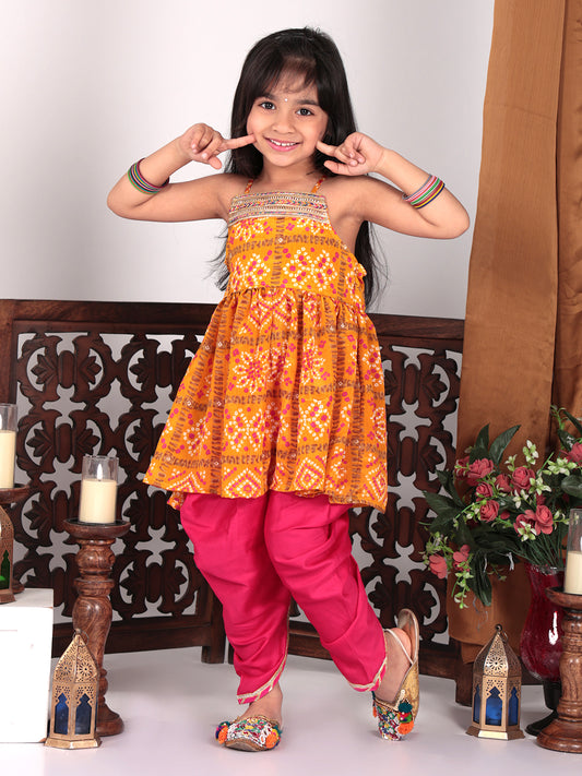 Yellow sleeveless kurti with pink dhoti