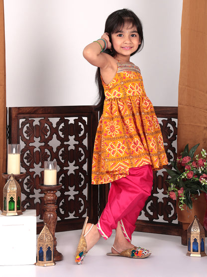 Yellow sleeveless kurti with pink dhoti