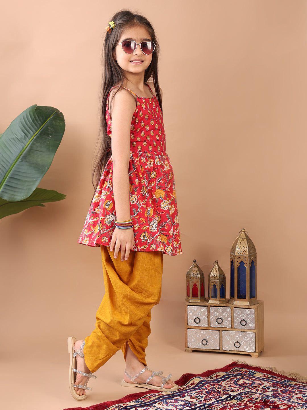Red Floral printed sleeveless Kurti paired with Yellow Dhoti