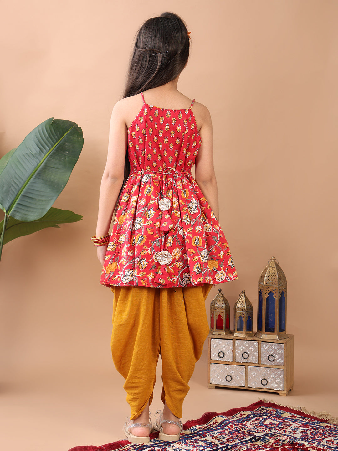 Red Floral printed sleeveless Kurti paired with Yellow Dhoti