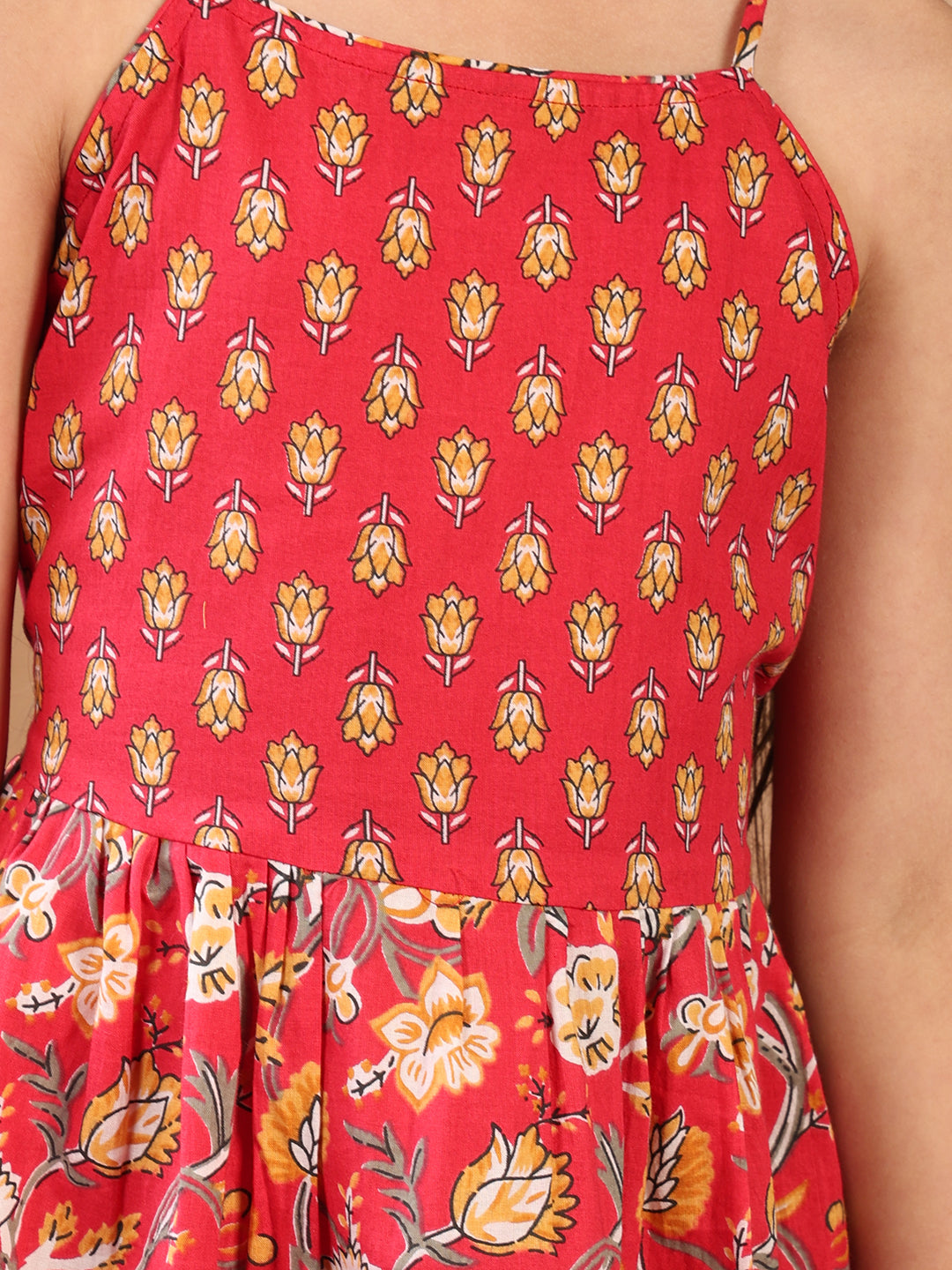 Red Floral printed sleeveless Kurti paired with Yellow Dhoti