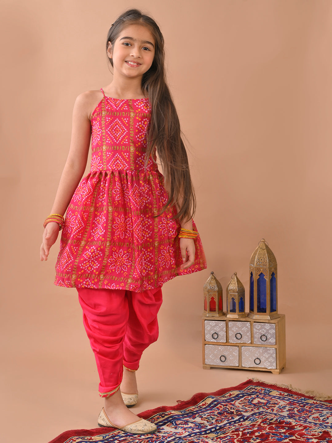Pink Bandez printed sleeveless Kurti paired with Pink Dhoti