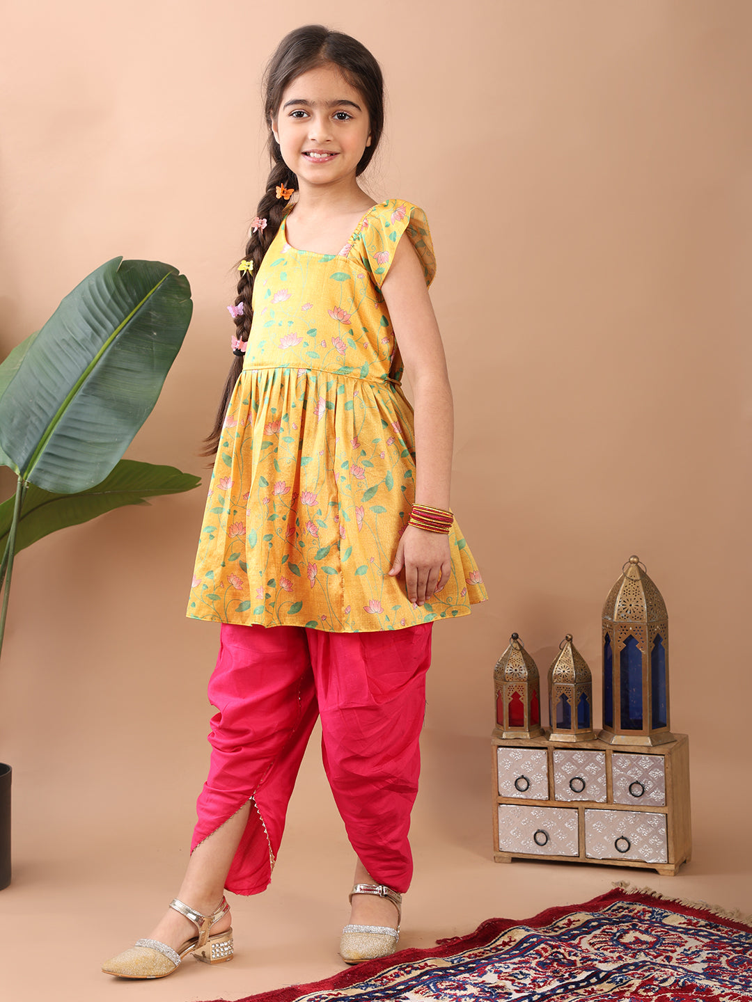 Yellow Lotus printed sleeveless Kurti paired with Pink Dhoti