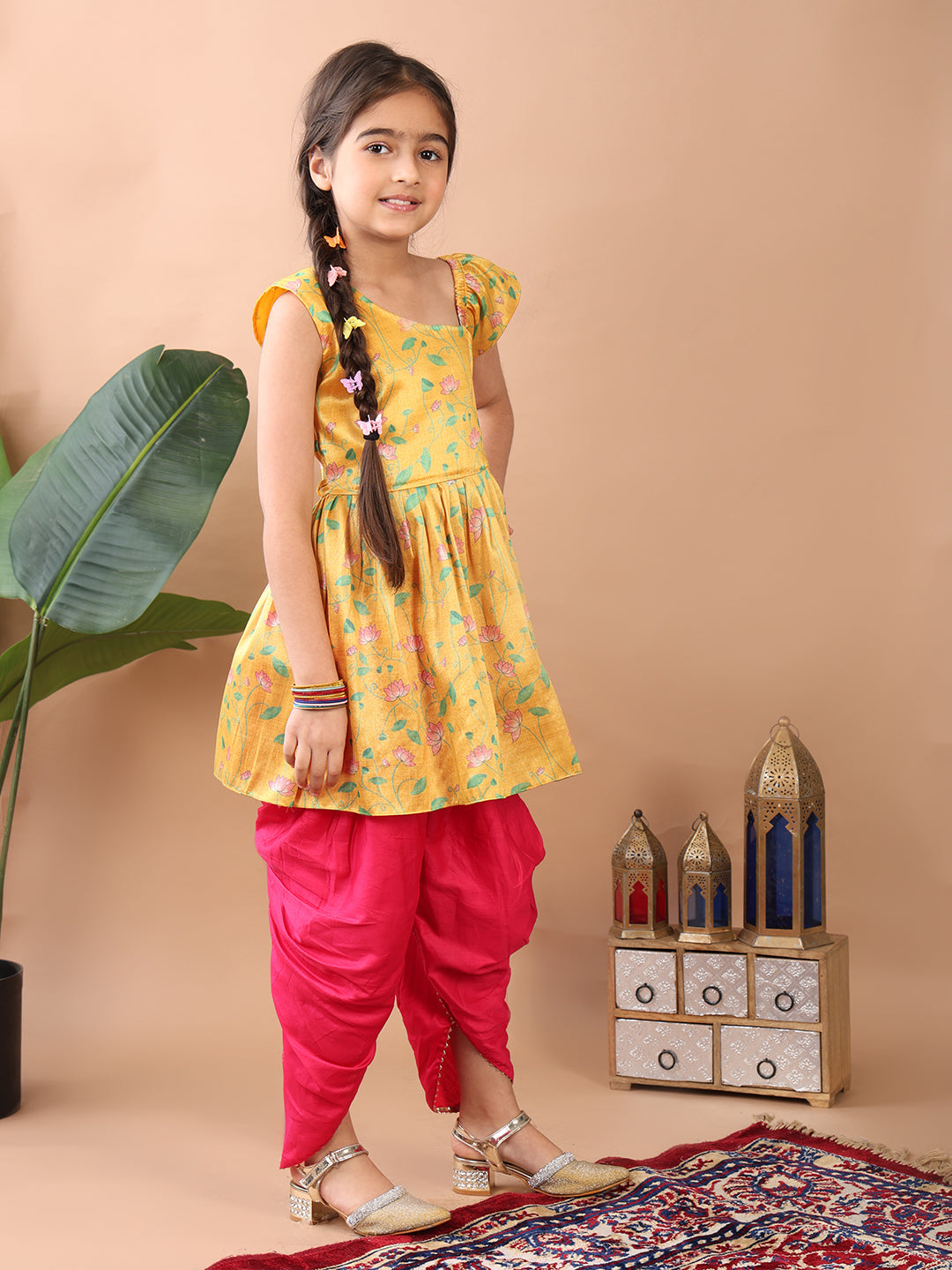 Yellow Lotus printed sleeveless Kurti paired with Pink Dhoti