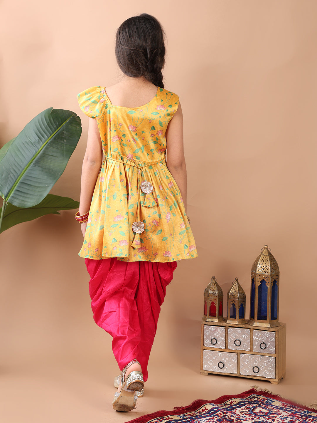 Yellow Lotus printed sleeveless Kurti paired with Pink Dhoti