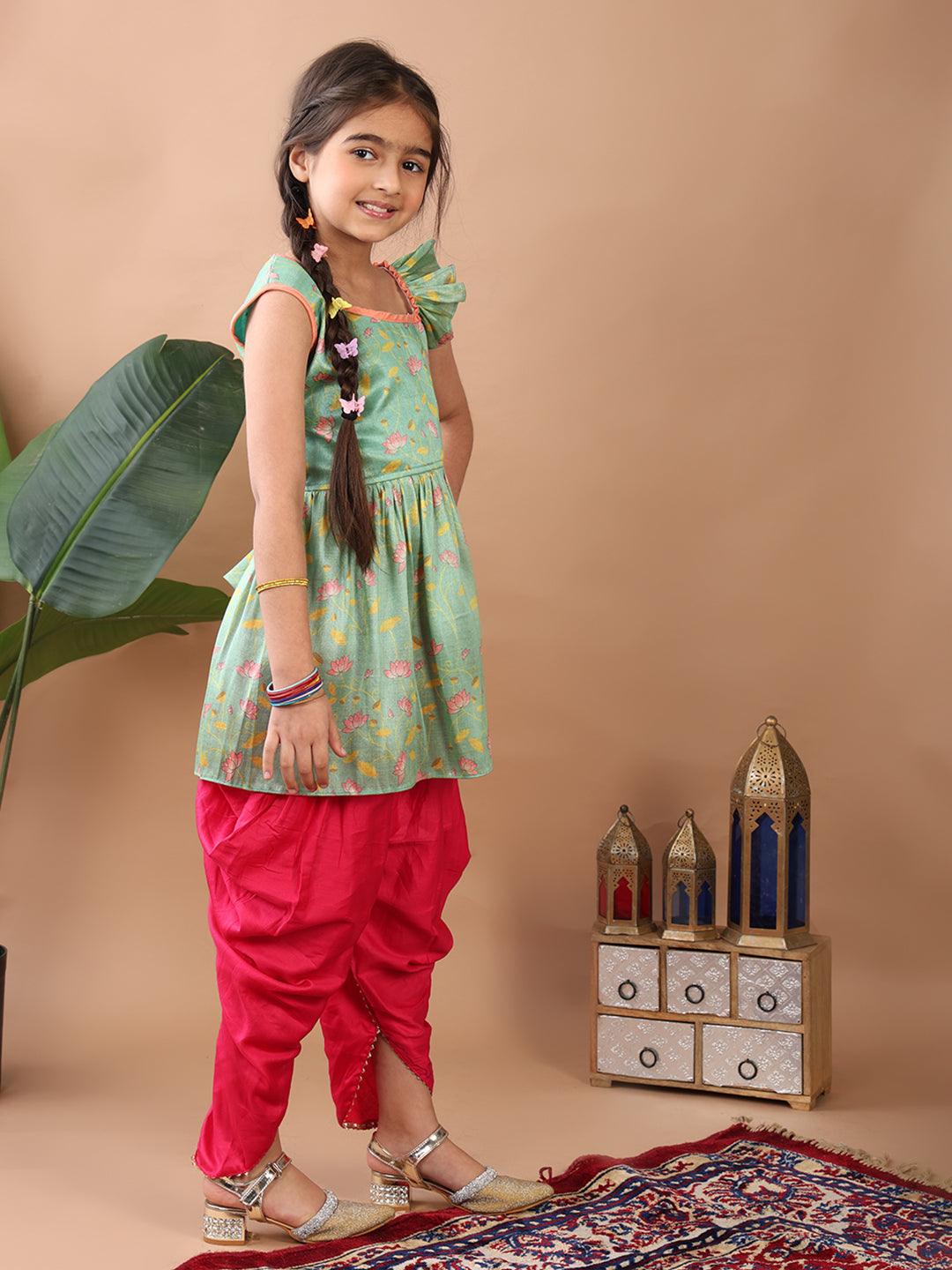 Green Lotus printed sleeveless Kurti paired with Pink Dhoti