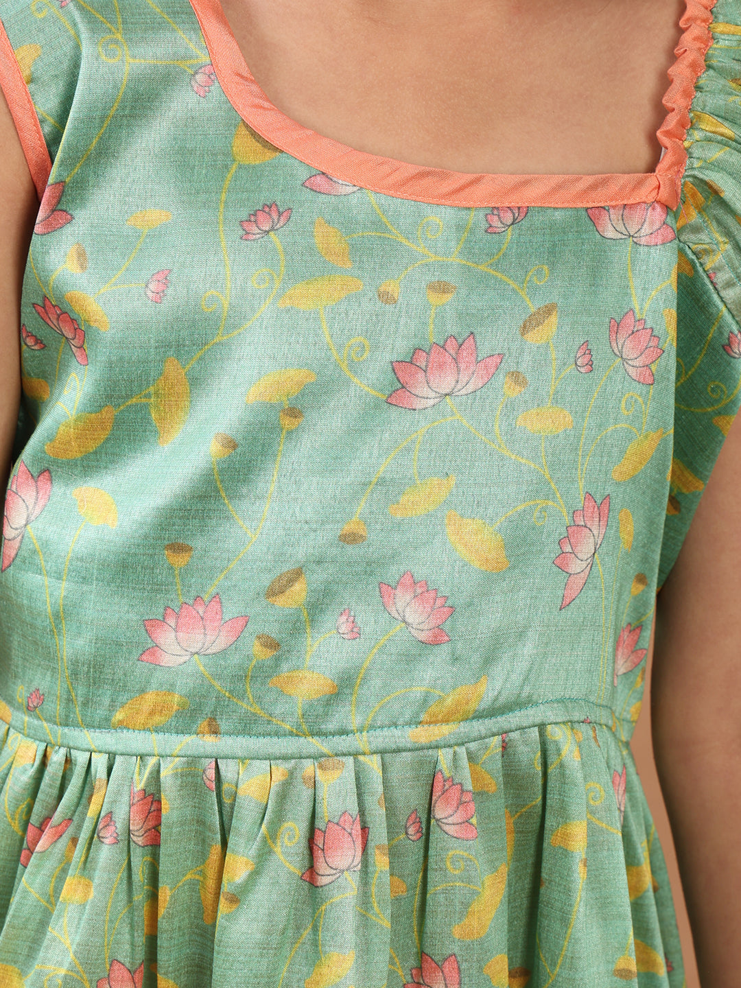 Green Lotus printed sleeveless Kurti paired with Pink Dhoti
