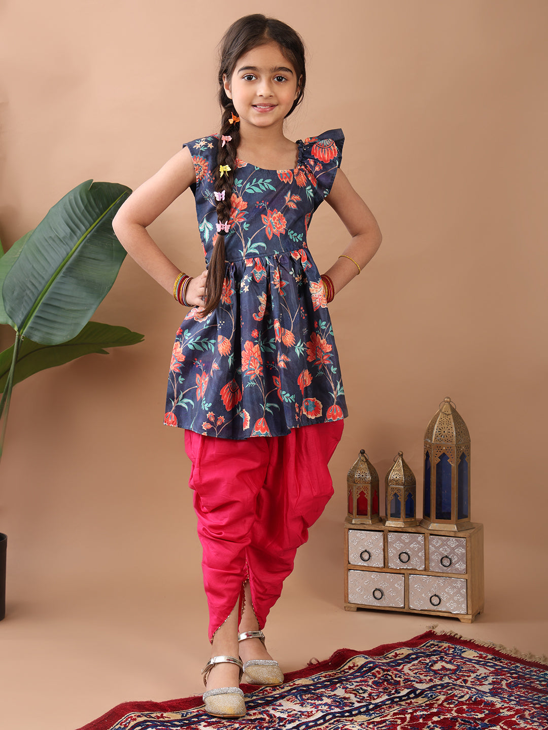 Blue Floral printed sleeveless Kurti paired with Pink Dhoti