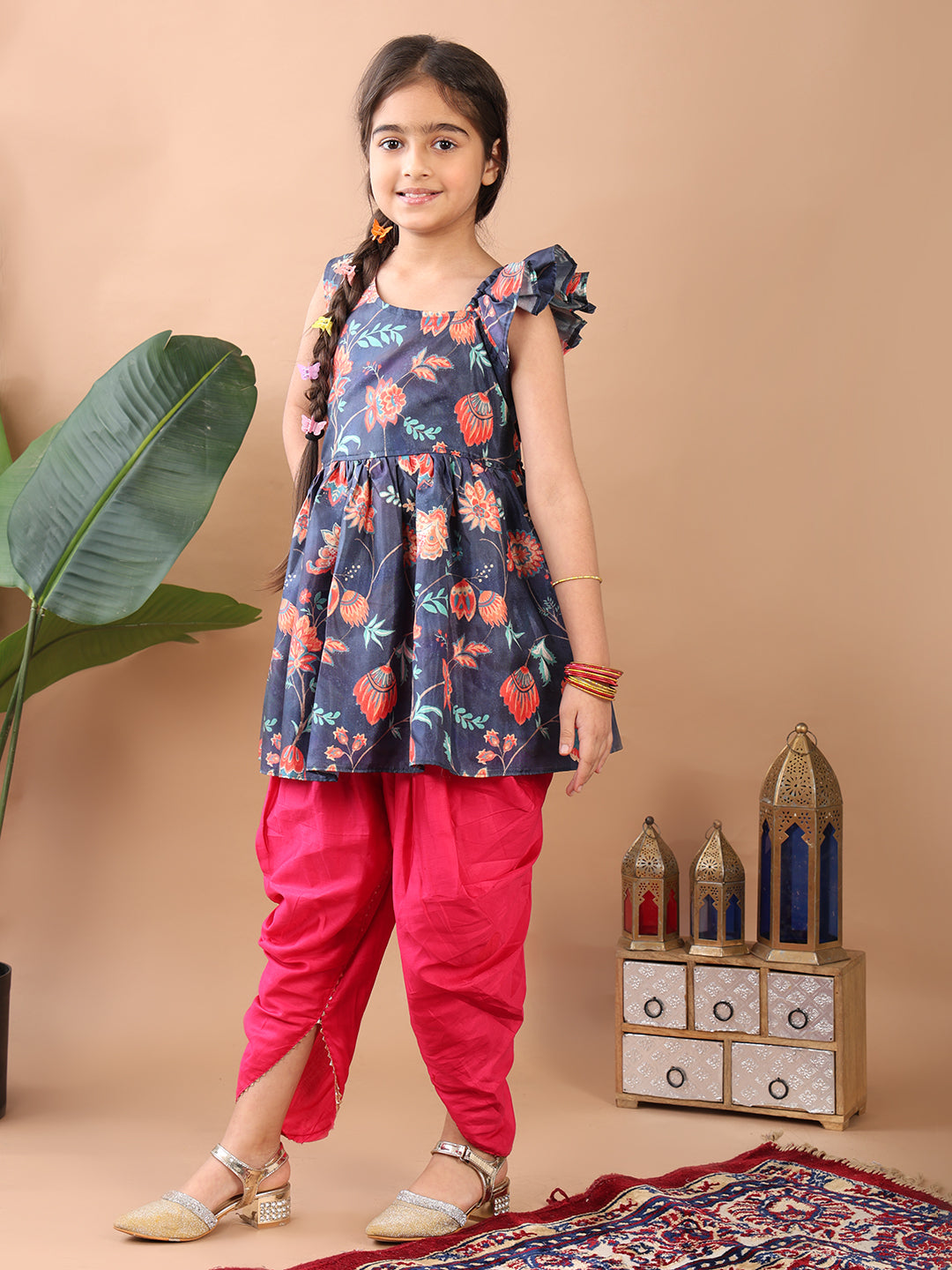 Blue Floral printed sleeveless Kurti paired with Pink Dhoti