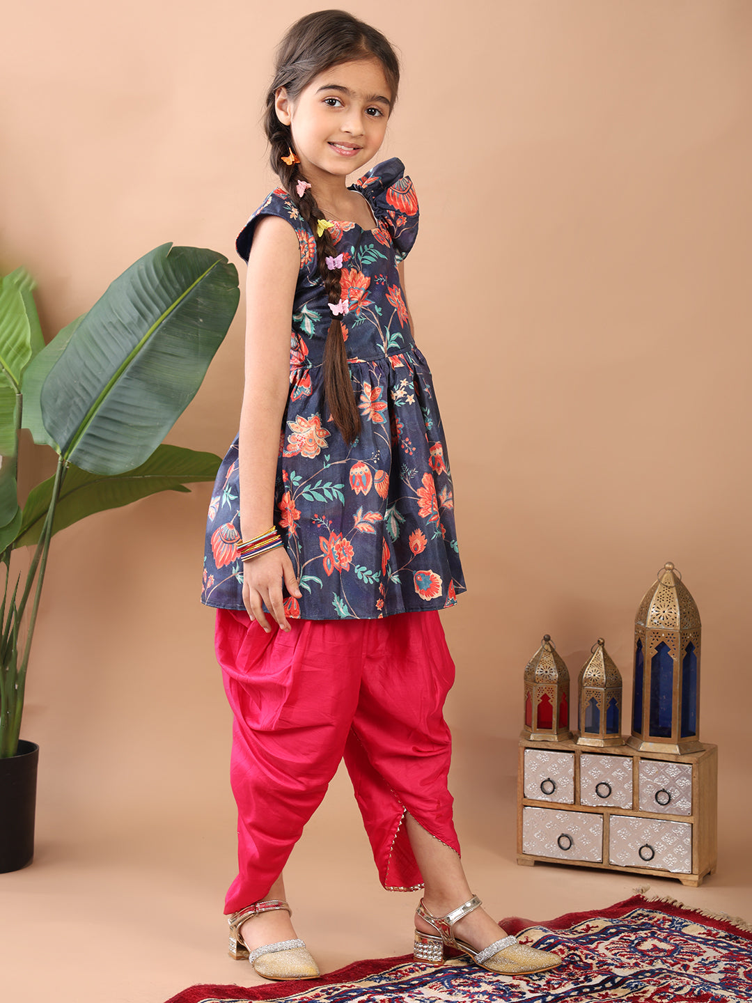 Blue Floral printed sleeveless Kurti paired with Pink Dhoti