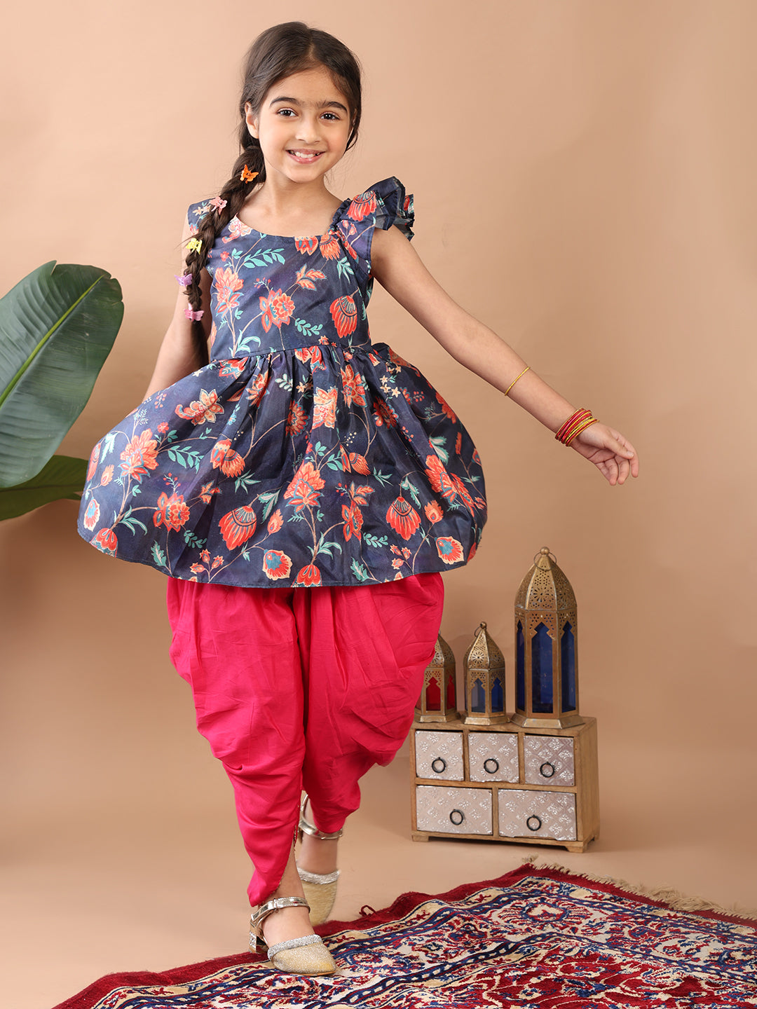 Blue Floral printed sleeveless Kurti paired with Pink Dhoti