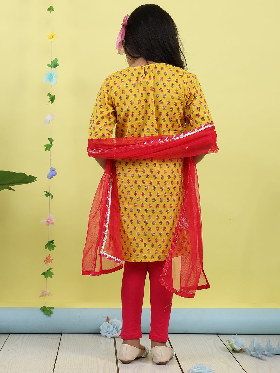 Yellow 3/4 sleeves printed cotton kurti paired with Pink leggings with Dupatta