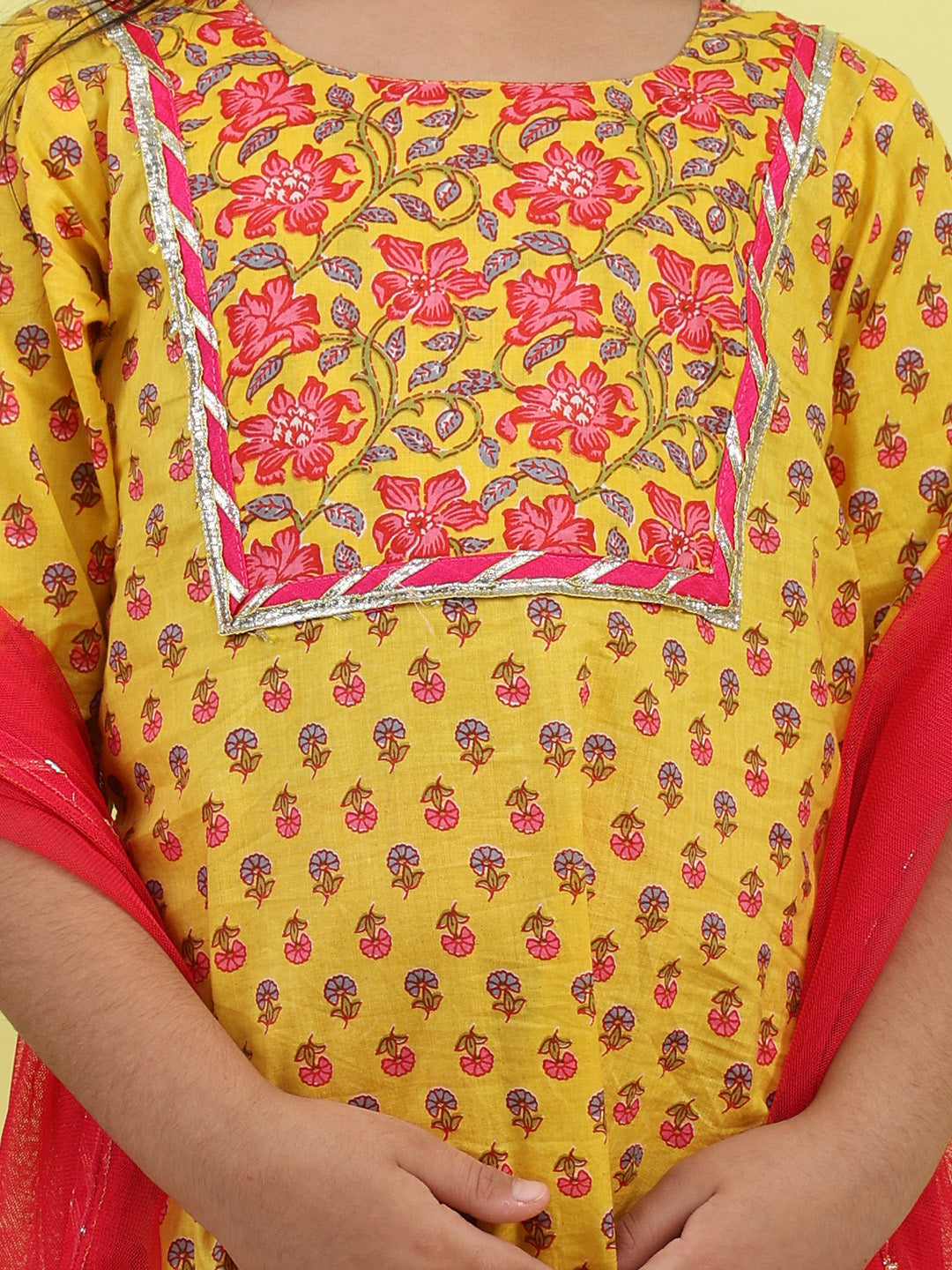 Yellow 3/4 sleeves printed cotton kurti paired with Pink leggings with Dupatta