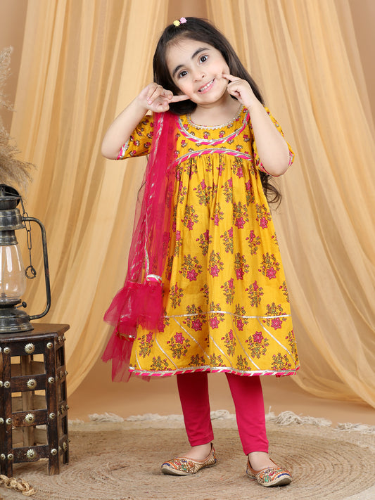 Yellow printed flared style kurti with pink leggings