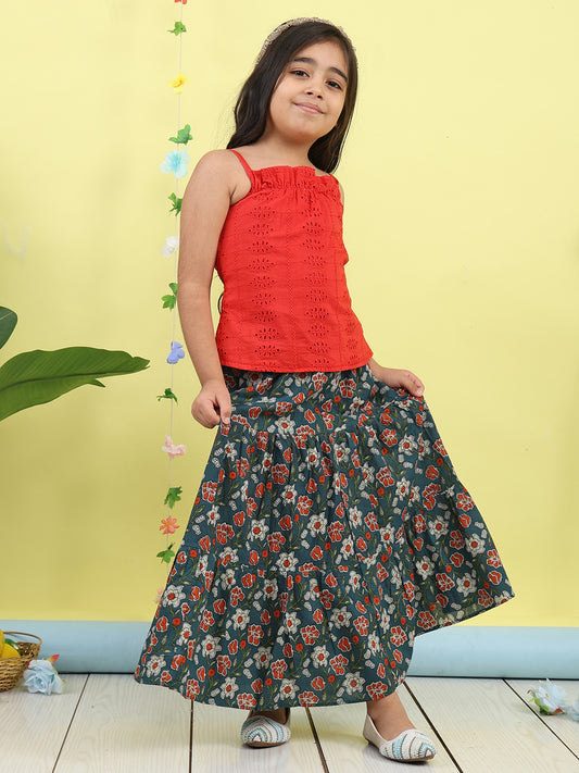 Red sleeveless tie on hakoba top with blue floral printed Skirt