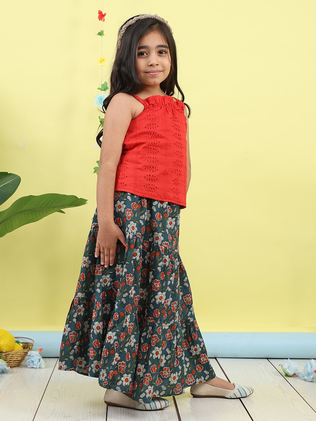 Red sleeveless tie on hakoba top with blue floral printed Skirt