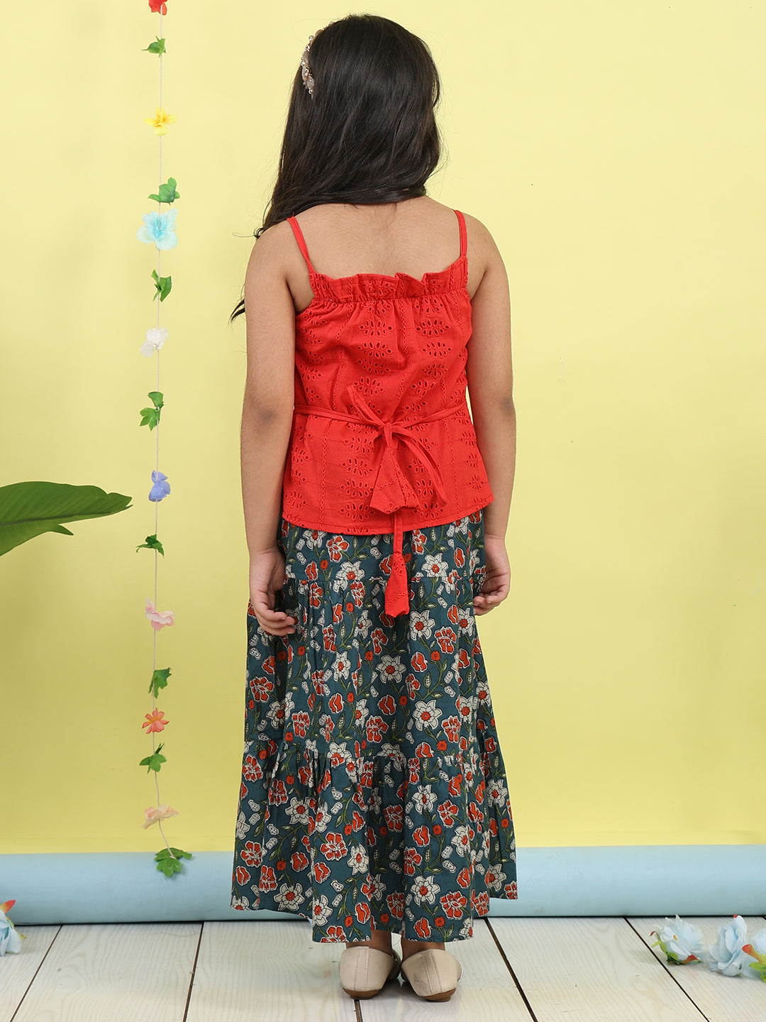 Red sleeveless tie on hakoba top with blue floral printed Skirt