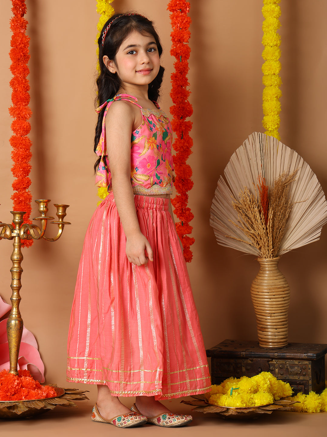 Pink Printed sleeveless top with pink golden lehenga