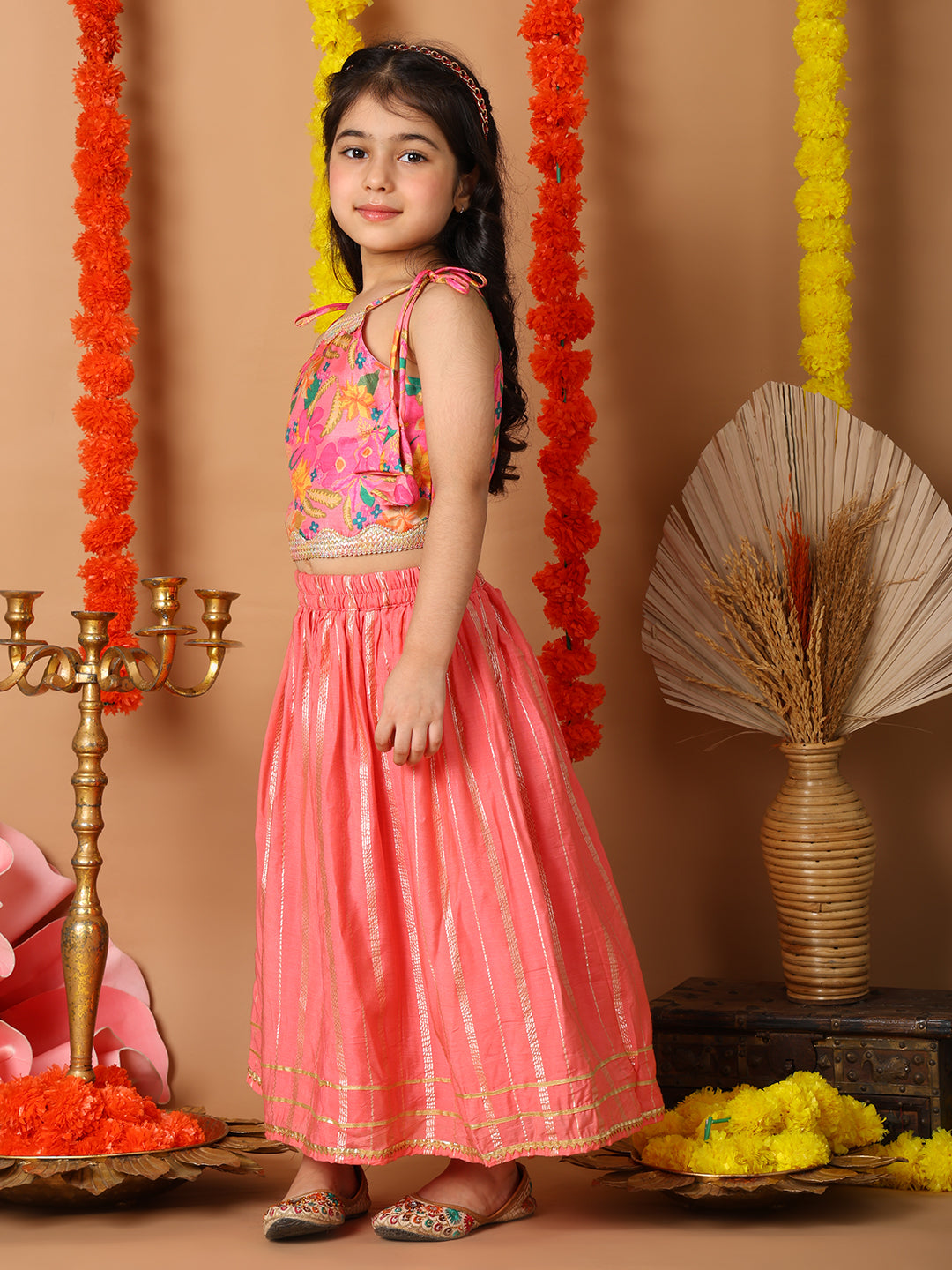 Pink Printed sleeveless top with pink golden lehenga