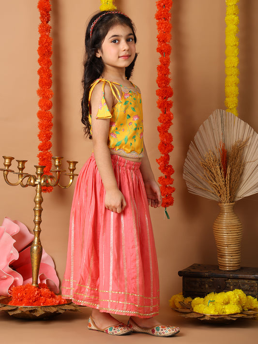 Yellow Printed sleeveless top with pink golden lehenga