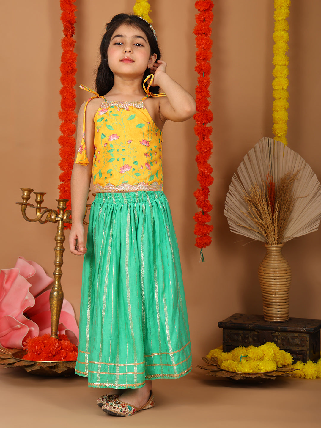 Yellow Printed sleeveless top with Green golden lehenga