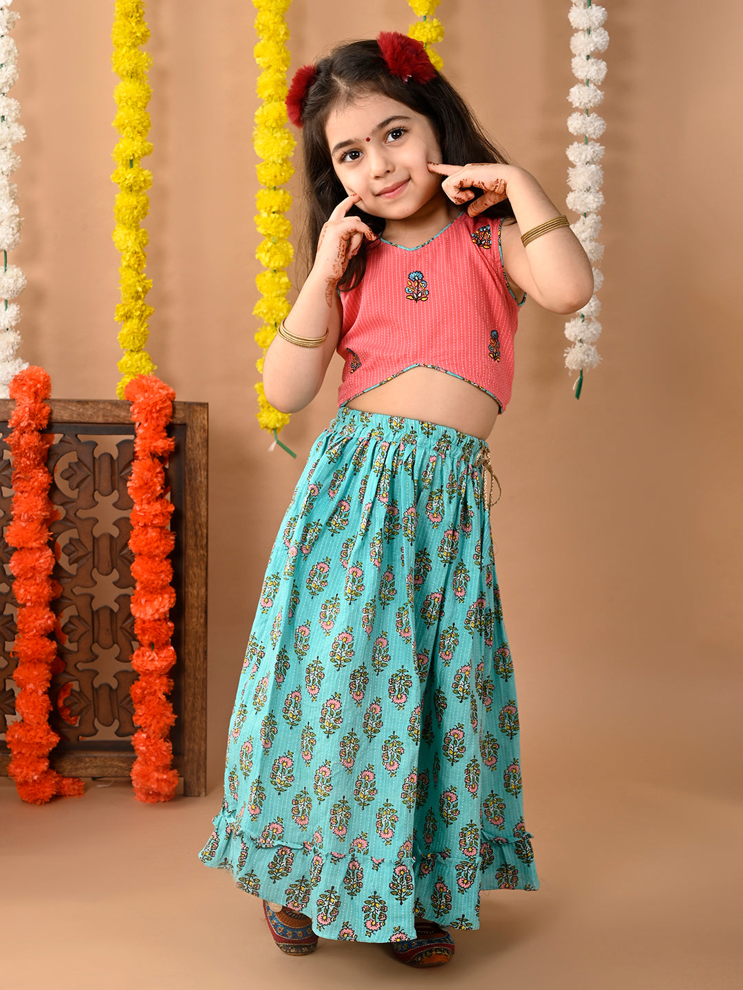 Green Cotton printed Lehenga with Peach sleeveless embroidered top