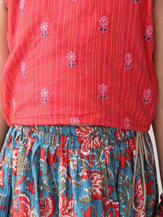 Red sleeveless embroidered blouse paired with printed lehenga- Red Blue