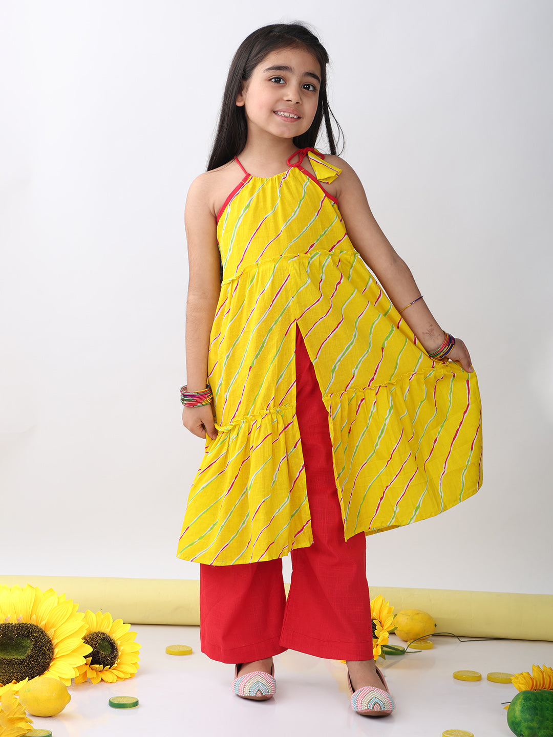Yellow sleeveless lehriya Kurti with red pant