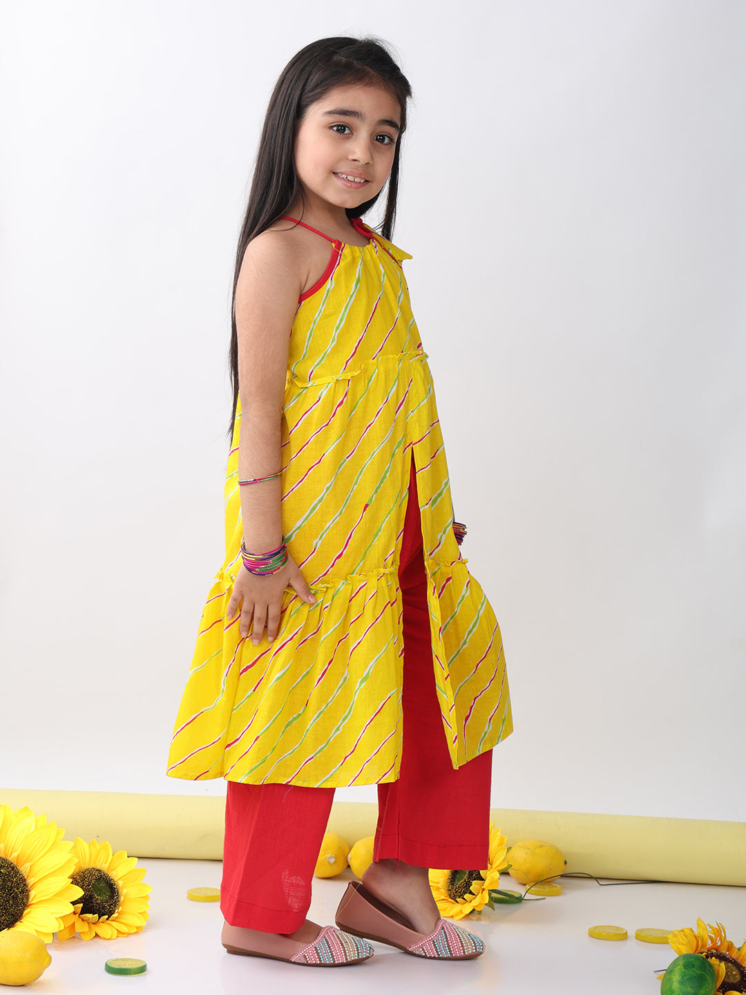 Yellow sleeveless lehriya Kurti with red pant