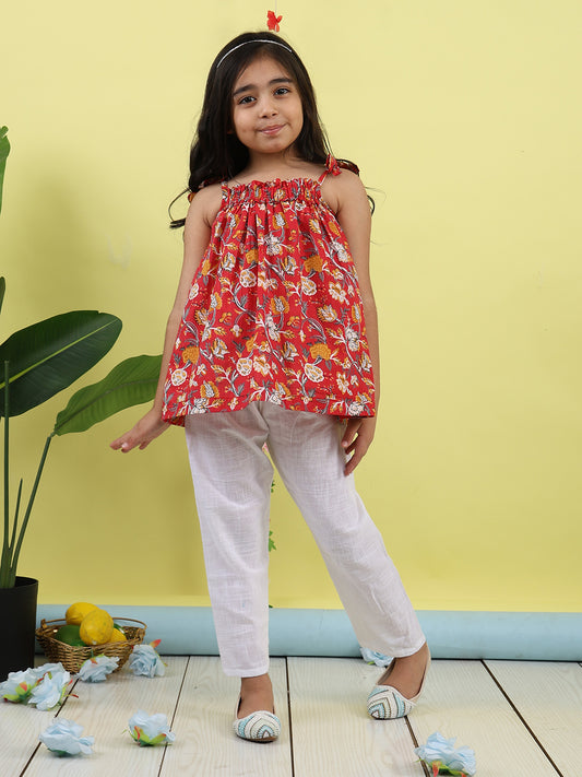 Red sleeveless Top with white pant