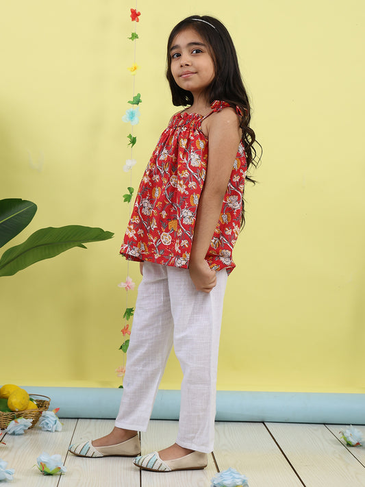 Red sleeveless Top with white pant