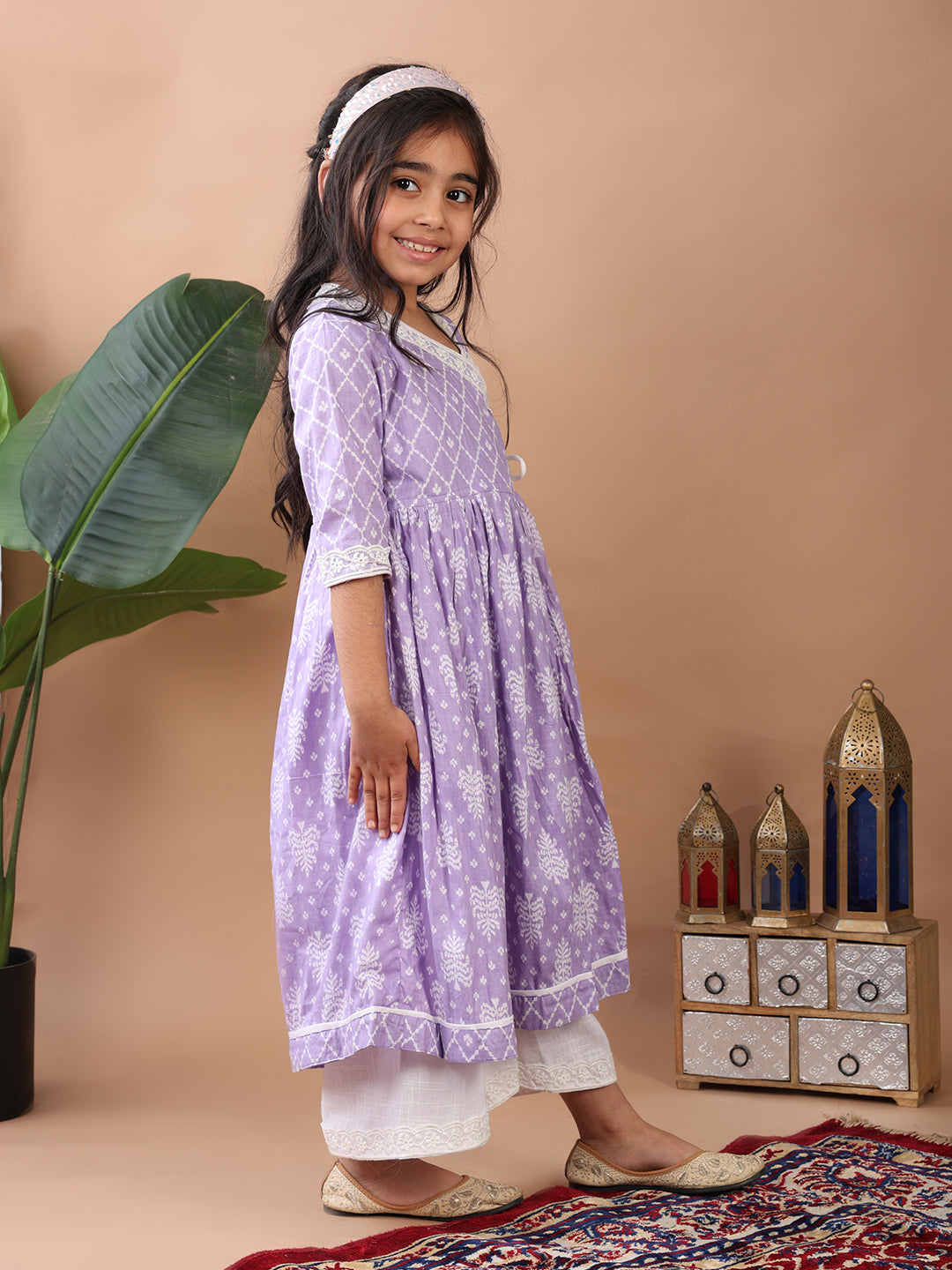 Purple Angrakha Kurti paired with white Plazo pant