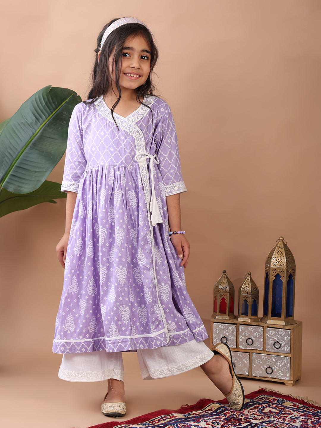 Purple Angrakha Kurti paired with white Plazo pant